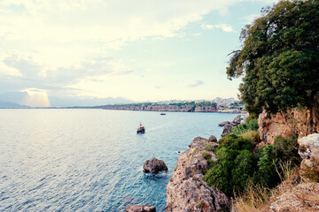 Beautiful landscape with sea bay, mountains and ship. Antalya, Turkey.
