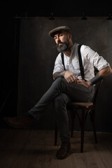 Fototapeta na wymiar Portrait of mature bearded man in vintage style. Hipster concept. High quality photo