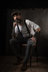 Portrait of mature bearded man in vintage style. Hipster concept. High quality photo