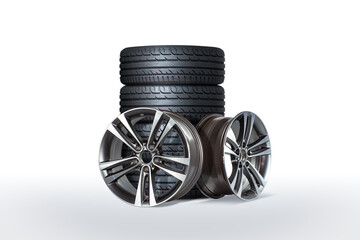 two aluminium rims laid in front of  a set of four tires 