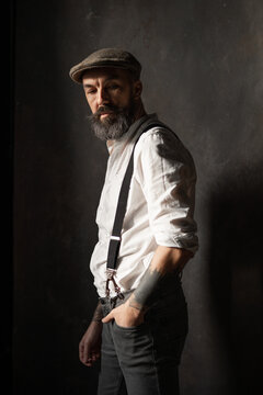 Portrait of mature bearded man in vintage style. Hipster concept. High quality photo