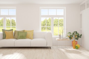 Fototapeta premium White living room with sofa and summer landscape in window. Scandinavian interior design. 3D illustration