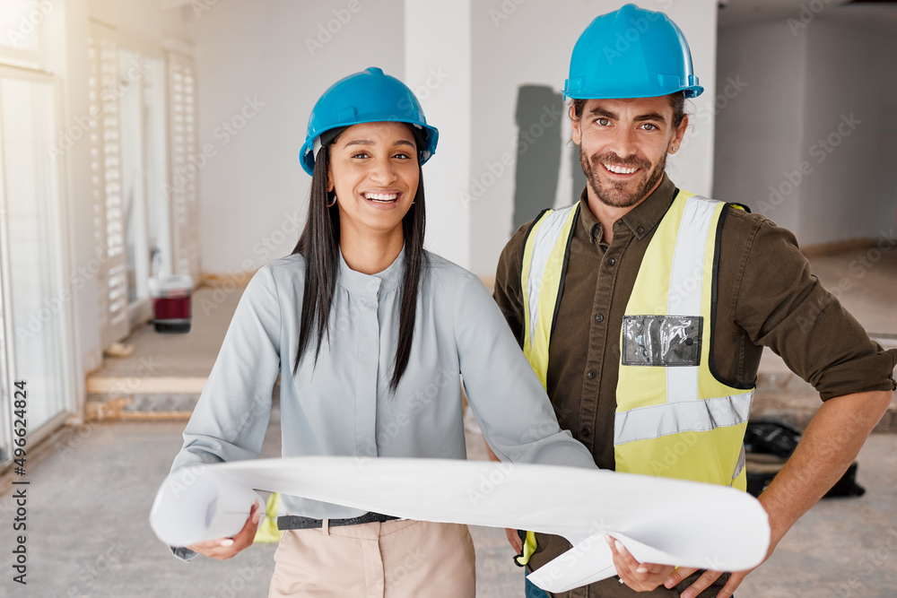 Poster building the house weve always dreamt of. shot of two young architects looking at building plans on 