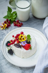 fresh ricotta with berries and flowers