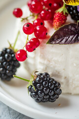 fresh ricotta with berries and flowers