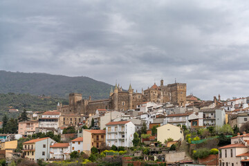 Fototapeta premium landscape view of the village of Guadalupe and the famous monastery and pilgrimage site under an overcast sky