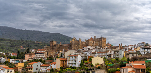 Fototapeta na wymiar landscape view of the village of Guadalupe and the famous monastery and pilgrimage site under an overcast sky