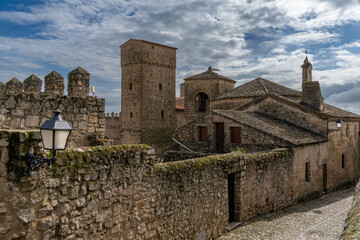 narrow cobblestone street leads through the historic and picturesque Old Town of Trujillo