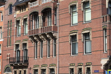 Fototapeta na wymiar Amsterdam Paulus Potterstraat Decorated Brick House Facades with Balconies, Netherlands