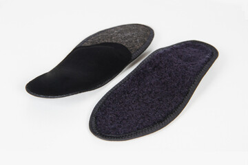 Black Insoles isolated on a white background. Medical orthopedic insoles. Foot care. Insole cutaway layers. Treatment and prevention of flat feet and foot diseases. Inner soles of shoes.