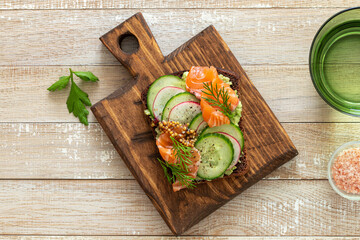 toast with rye bread, salmon, avocado