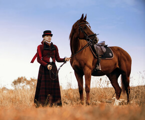 girl standing next to a horse