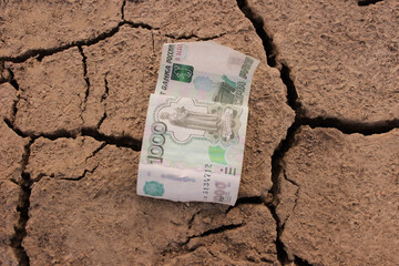 Russian money and rubles lie on the histograms and next to the children's soldiers, sanctions...