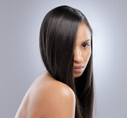 Theres nothing a keratin treatment cant fix. Studio shot of a beautiful young with with healthy brown hair.
