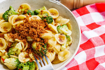 orequette pasta with broccoli on a white background