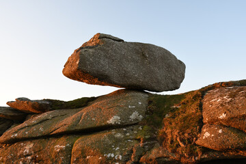 A balanced boulder on Helman Tor Cornwall at sunrise © Tim