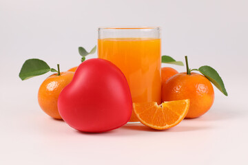 oranges, healthy fruit, mandarin oranges, orange juice in glass, vitamin C, against a white background with refreshing drops of water