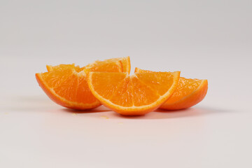 oranges, halved oranges, healthy fruit, mandarin oranges, vitamin C, against white background with refreshing water droplets