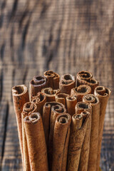 cinnamon on dark wood close up, concept for spices 