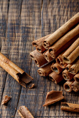 cinnamon on dark wood close up, concept for spices 