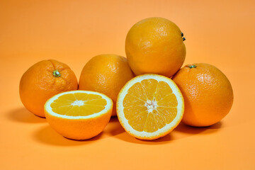Whole and sliced oranges