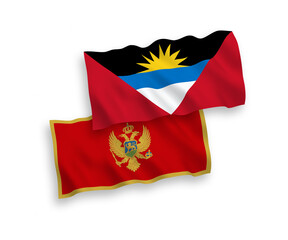 National vector fabric wave flags of Montenegro and Antigua and Barbuda isolated on white background. 1 to 2 proportion.