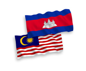 National vector fabric wave flags of Kingdom of Cambodia and Malaysia isolated on white background. 1 to 2 proportion.