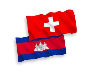 National vector fabric wave flags of Kingdom of Cambodia and Switzerland isolated on white background. 1 to 2 proportion.