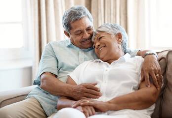 I find comfort in your arms. Shot of a senior couple spending time together at home.