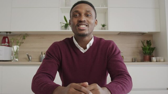POV of a young man greeting his friends and talking to them on a video call laptop web camera