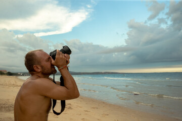 Professional photographer on the beach