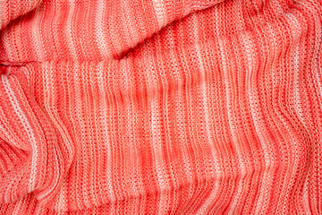 Red warm sweater textile background