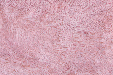 Pink fur texture top view. Abstract wallpaper, textile surface. Coral fluffy fabric coat background. Winter fashion color trends feminine flat lay, female blog backdrop for text signs desidgn. 