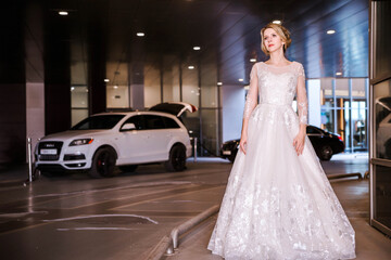 Obraz premium Bride with short hair and in a white puffy dress posing for the camera
