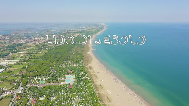 Inscription on video. Venice, Italy. Beaches of Punta Sabbioni. Cavallino-Treporti. Clear sunny weather. Neon white effect text, Aerial View