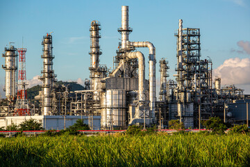 Fototapeta premium Scene evening of tank oil refinery plant tower and column tank oil of Petrochemistry industry