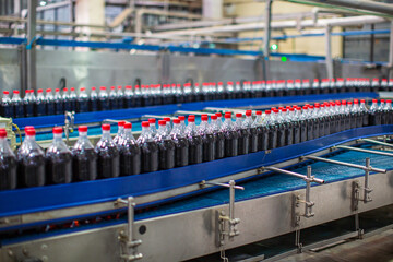 Beverage conveyor flowing with bottles