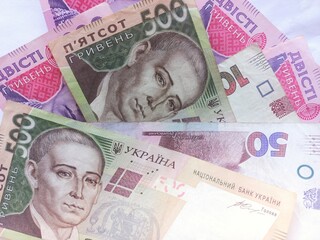 Ukrainian money. Ukrainian money lies on a white background. ukrainian hryvnia concept of finance and banking. European currency