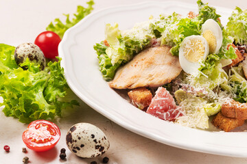 Fresh caesar salad on white plate