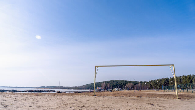 Soccer goal post on the beach with sand and blue sky. Football gate, beach soccer. Football gate at empty beach.