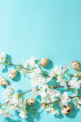 Happy Easter festive flat lay with blooming cherry and eggs, traditional symbol spring holiday
