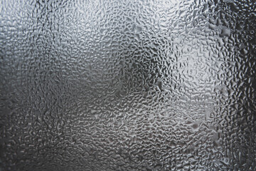 Abstract pattern of melt water on the window glass.