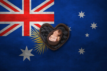 Newborn portrait in heart on background of national flag. Photography peace concept. Australia