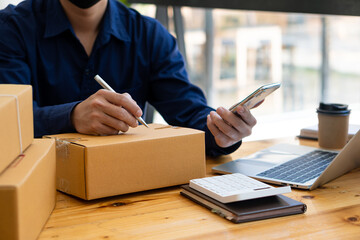 Start a business by writing an address on a box and taking orders from customers with a laptop at...