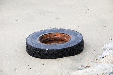Old tires washed up on the shore