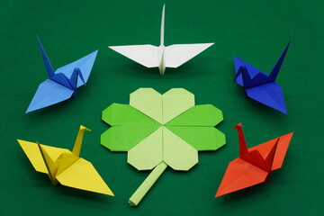 Ukrainian Russian flag colored paper cranes and clover