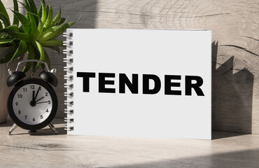 tender. The word is written in a notebook . Business text