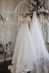 wedding dress hanging on closet door