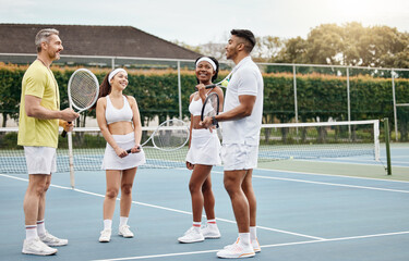 Listen to your coach. Full length shot of a handsome mature male tennis coach talking to his students out on the court.