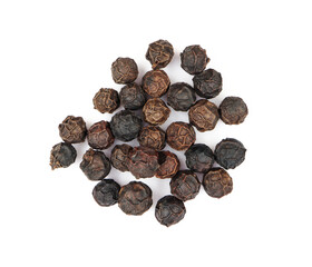 pile of black pepper seeds. isolated white background	
